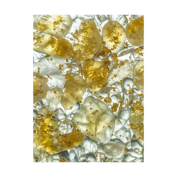 steklenička s kristali zlata